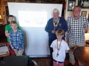 President John with Rotarian Allan Lorden and three members of Comrie Youth Extreme Sports.